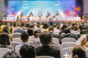 Accounting and finance professionals listening to a speaker at an accounting conference 2025