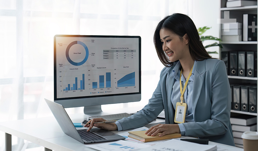 Accountant working with a digital dashboard displaying financial data and charts showing modern accounts receivable tracking