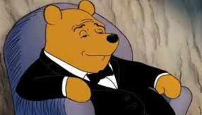 Winnie the Pooh in a tuxedo with a smug face, used for finance jokes that humorously dress up downturns like a bear market.